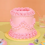 Vintage Cake - Single Colour with pink Swiss Meringue icing, 6-layer tall sponge, handcrafted by Crumbs & Doilies.